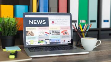Image of news on an open laptop